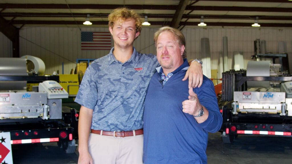 Todd Andrews and son Preston in the Classic Metals Inc. rollforming plant.