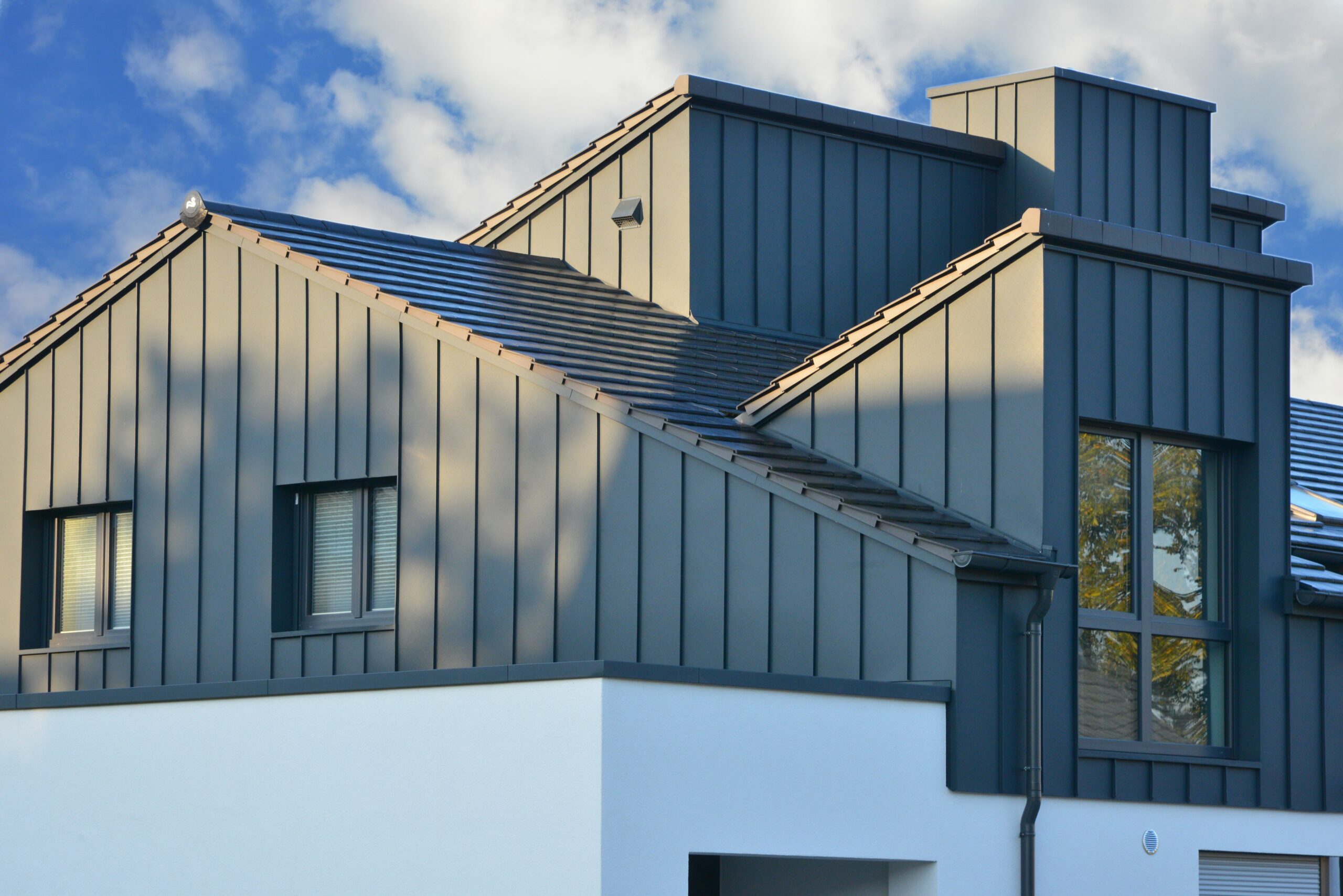 Home with board and batten metal siding