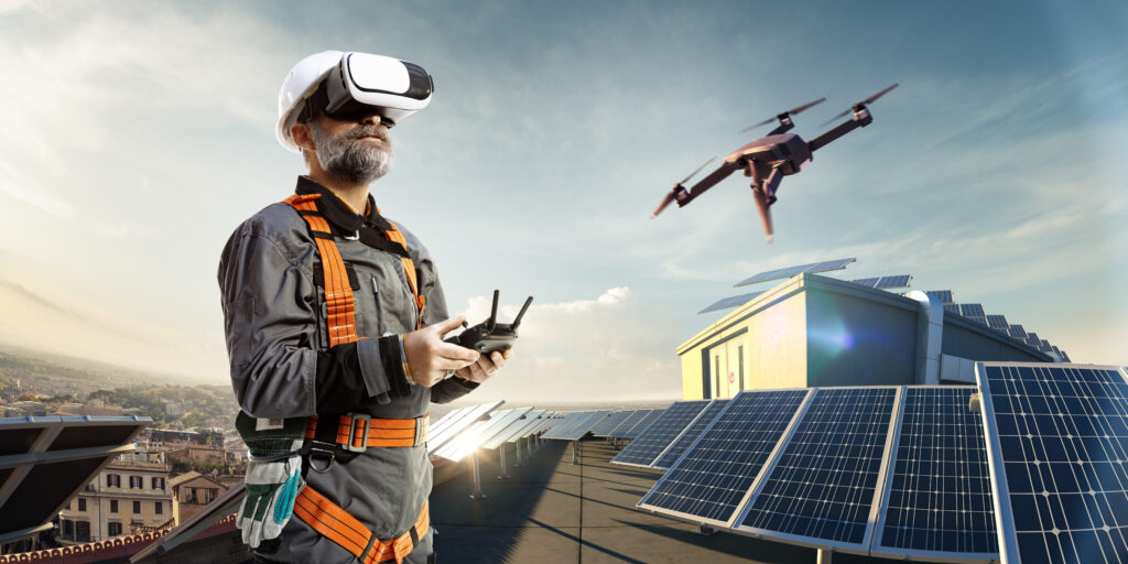 Worker operating drone over roof with solar panels.