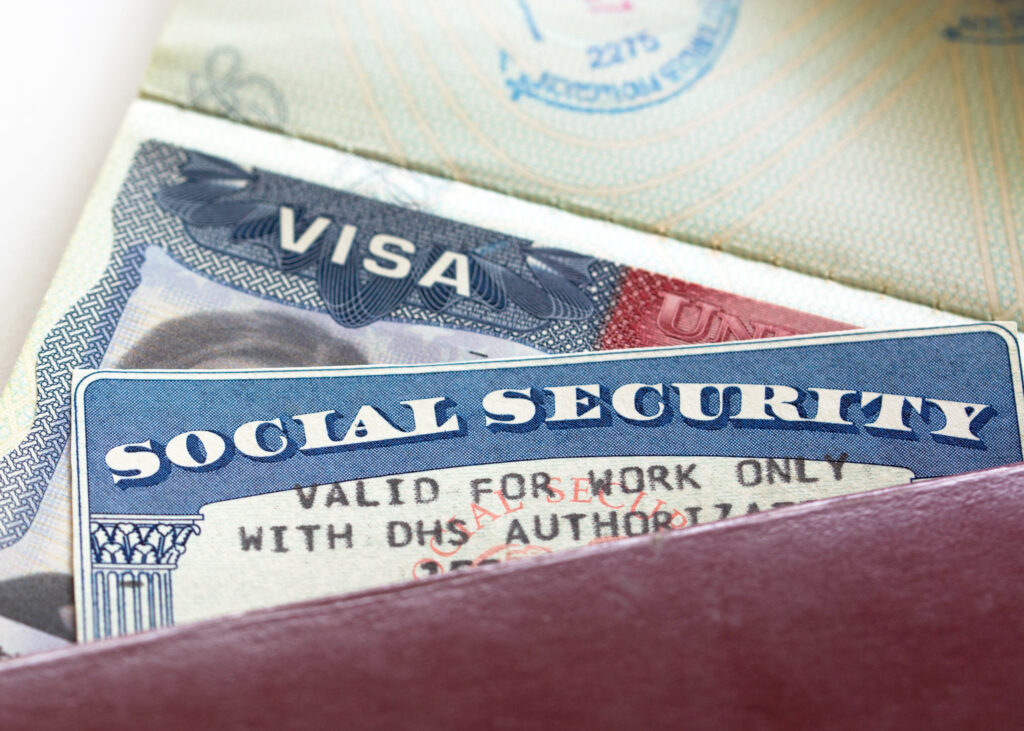 Photo showing a work visa and social security card.