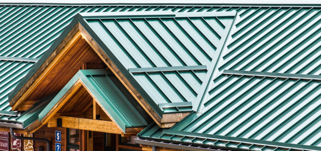 Green metal standing seam roof on a welcome center.