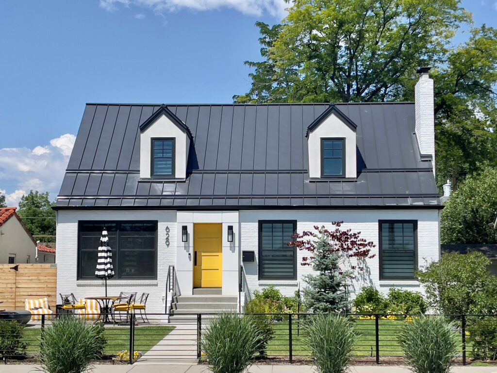 House with standing seam roof.
