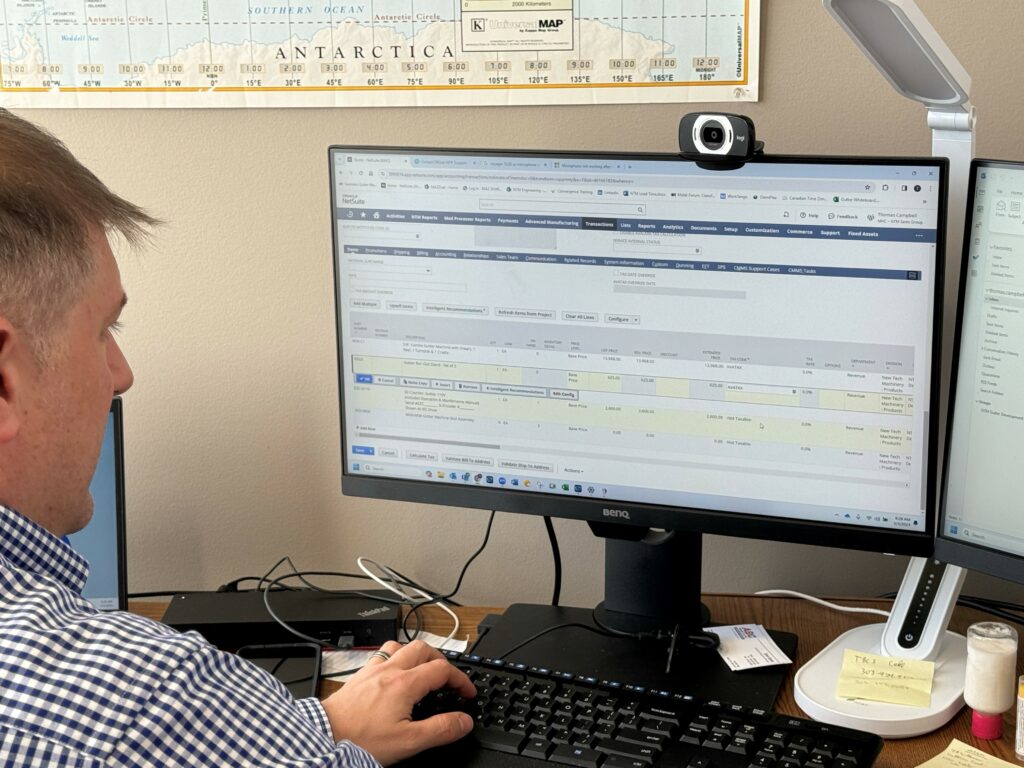 Account manager creating a quote on his computer.