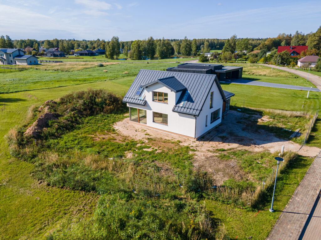 Home in the country with a metal roof.