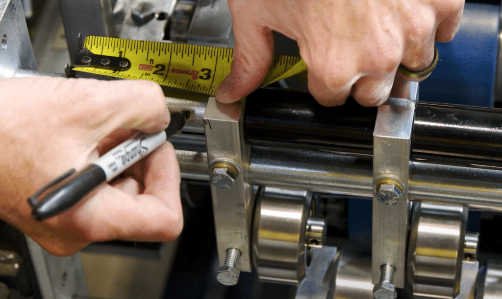 Measure and mark the bar.
