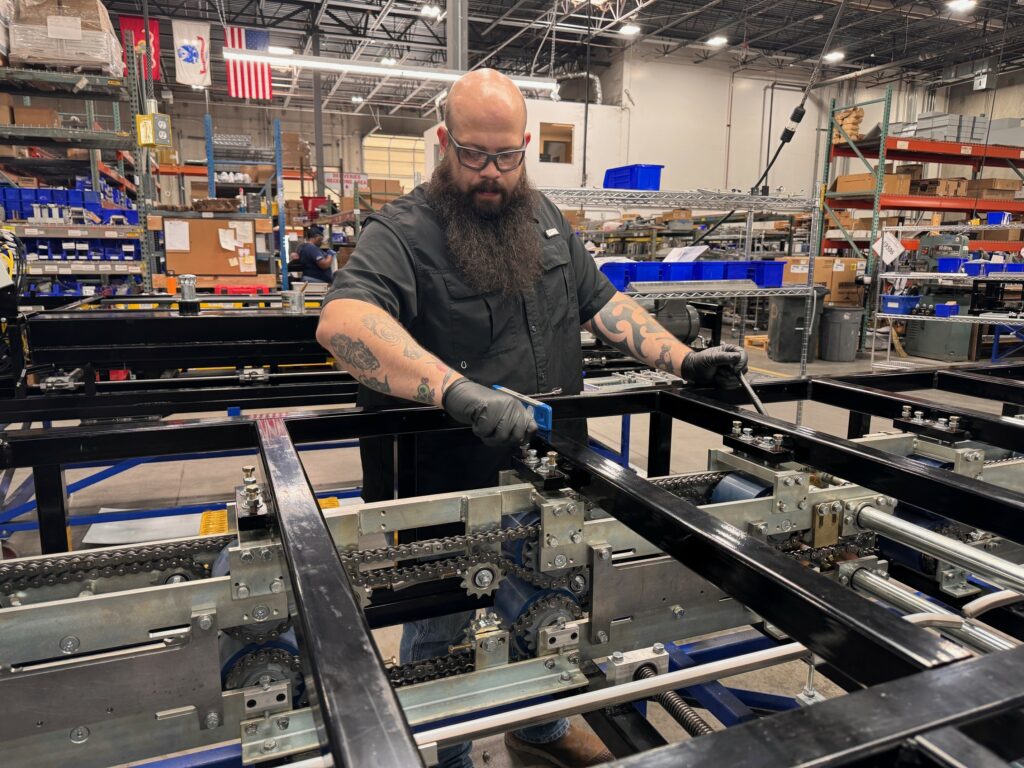 Machinist assembling a rollformer.
